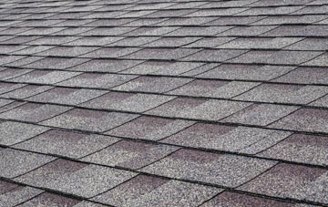 Wringsdown tiles for shallow pitch roofing